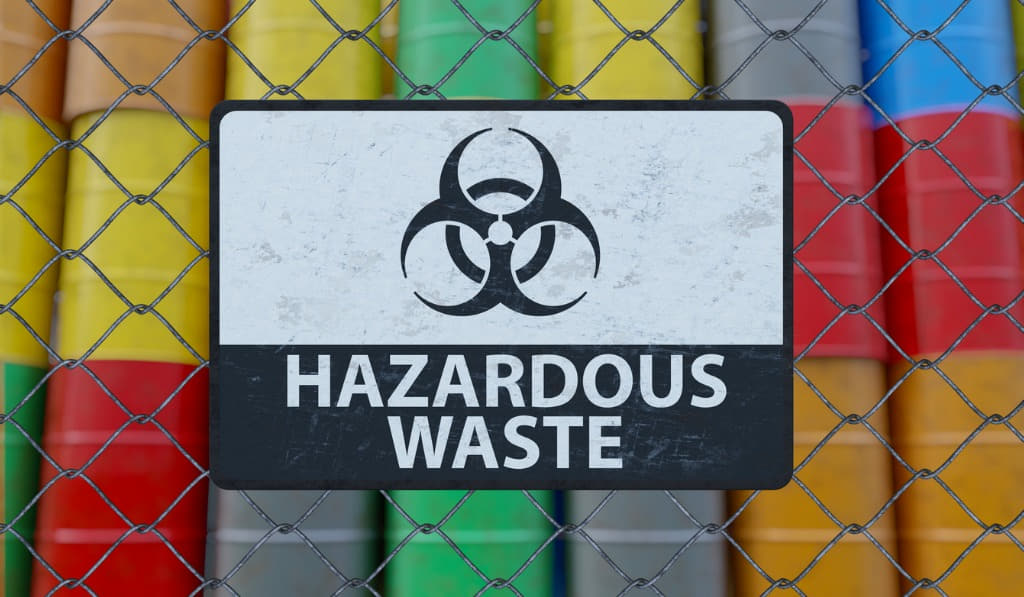 hazardous waste sign with colored barrels hazardous waste sign with colored barrels containing hazardous waste
